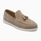 paire à gland coloris beige disposée sur fond uni clair