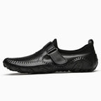 Mocassin ajouré homme à bride coloris noir, vue de profil