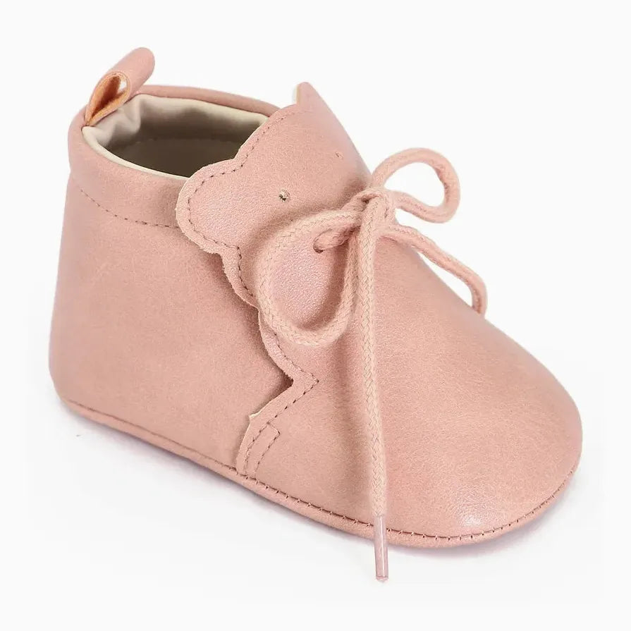 paire de bottines bébé rose clair avec languette décorative en forme d’ourson