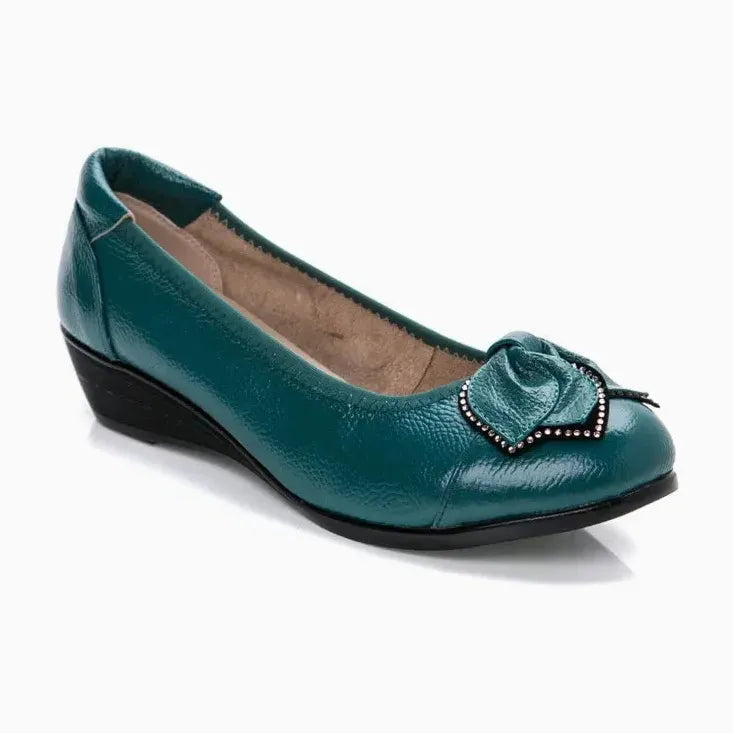 paire seule coloris vert canard, posée sur fond uni