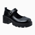 Mocassin noir plateforme à boucle visible sur fond uni coloris noir mat